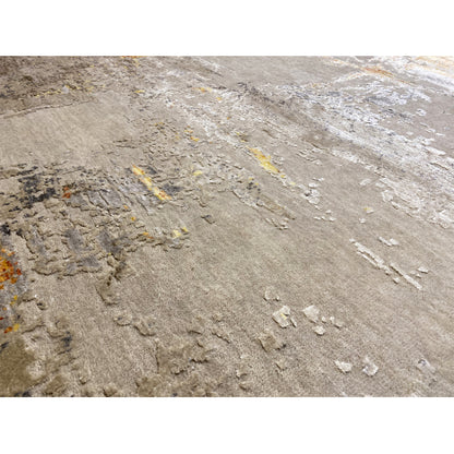 Close-up: Modern rug with a raised vintage pattern in beige, gray, and yellow-orange lines