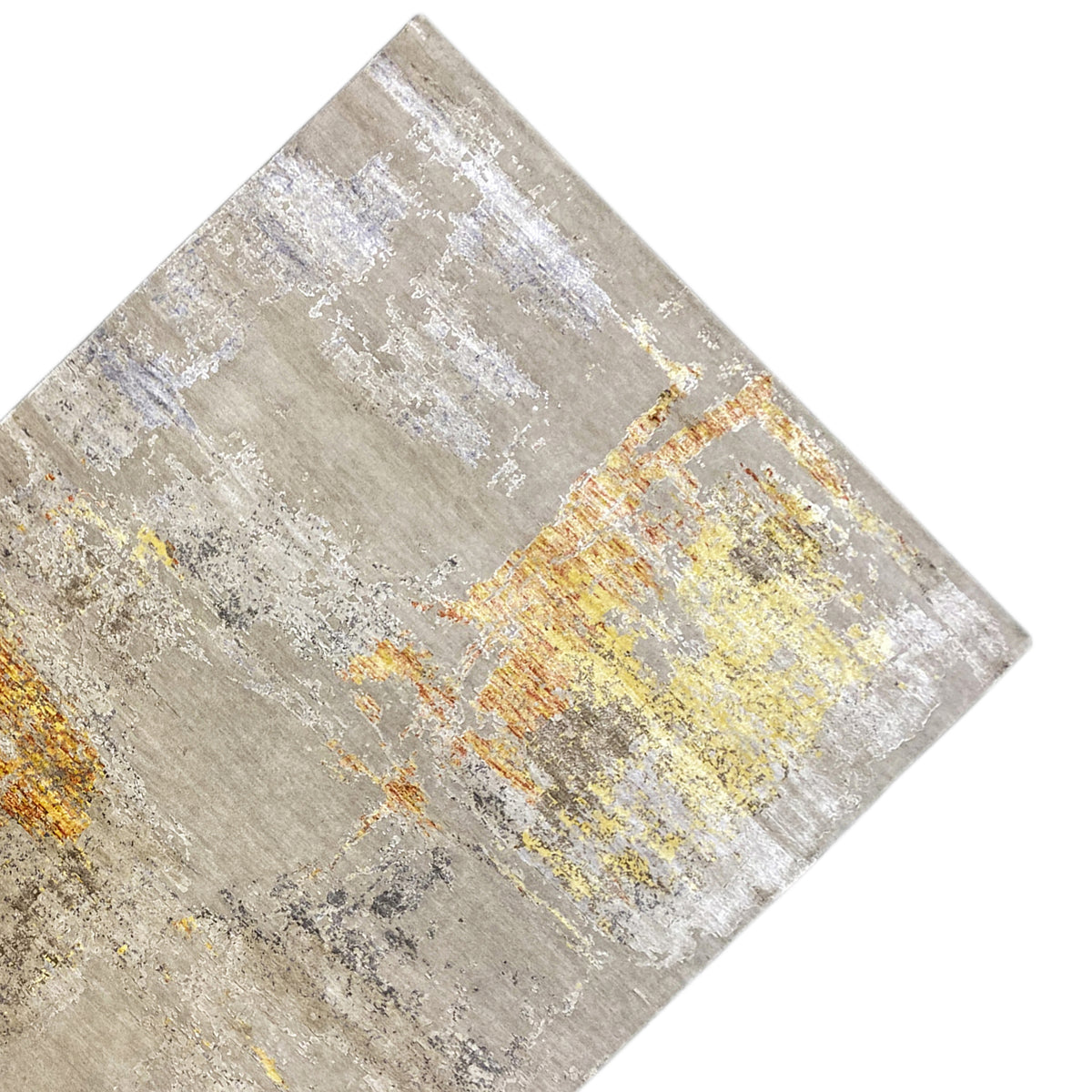 Modern rug laid at an angle: Beige surface with yellow-orange color patches and spots