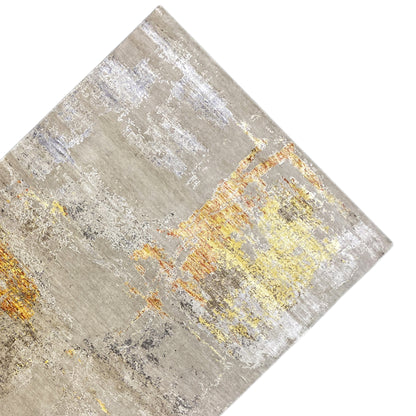 Modern rug laid at an angle: Beige surface with yellow-orange color patches and spots
