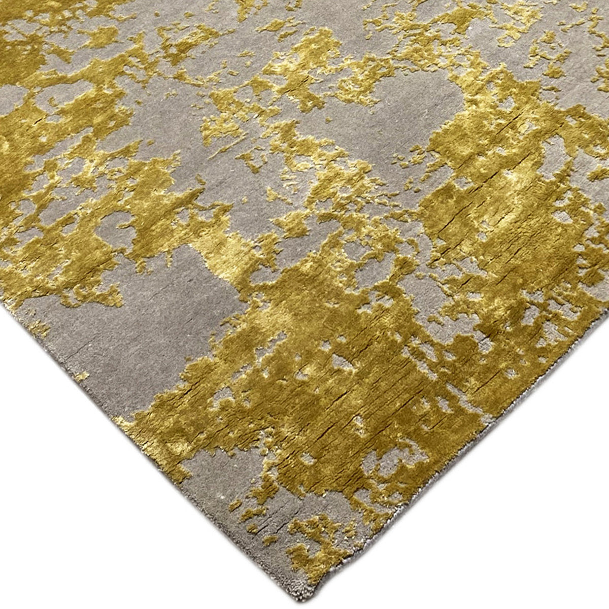 Modern rug (311x200 cm) with a gray pile and gold-colored, solid patterned areas