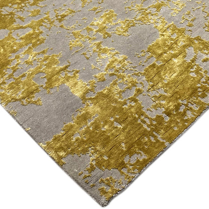 Modern rug (311x200 cm) with a gray pile and gold-colored, solid patterned areas