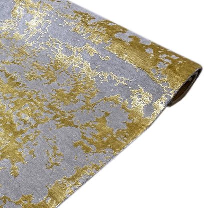 Modern rug (311x200 cm) laid out: gray base pattern with gold-colored speckled design