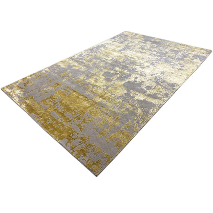 Modern rug 311x200 cm with a diagonal view: gray base and gold-colored speckled look.
