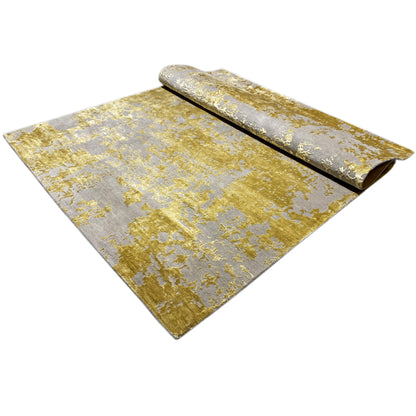 Rug with folded-over sides, a gray-gold texture, and abstract vintage accents.