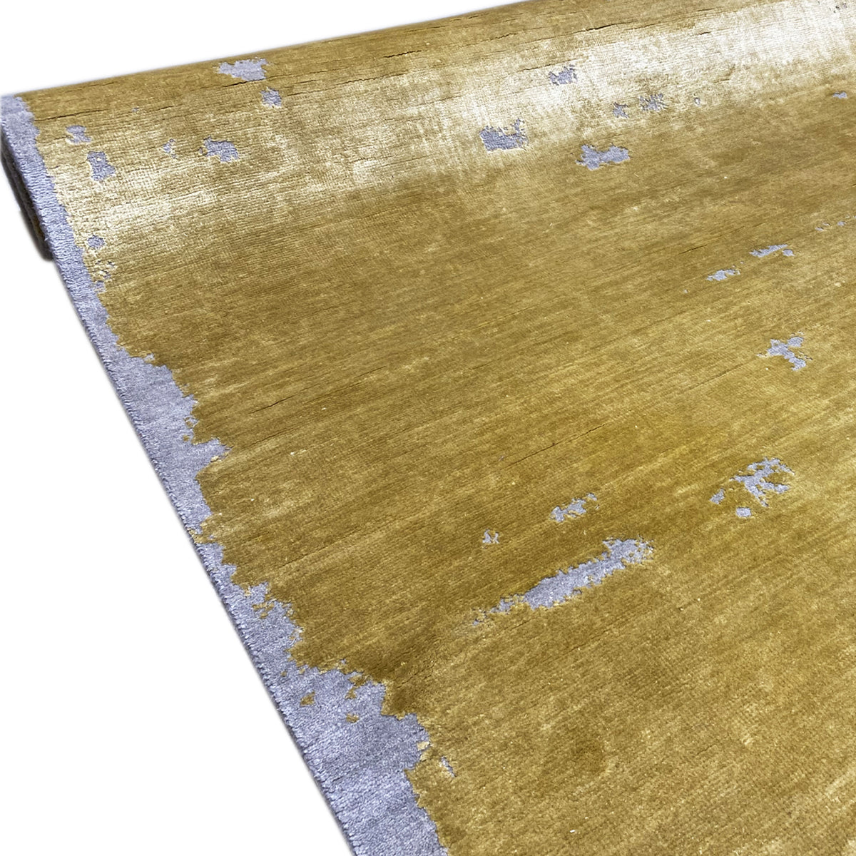 Corner view: modern mustard carpet with light blue ornaments and a gray border