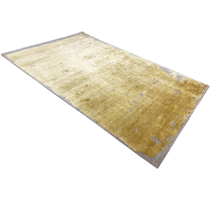 Modern yellow rug with blue-gray flecks, rectangular, narrow edge border