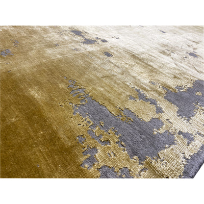 Close-up: modern carpet with a yellow surface and blue-gray color sections