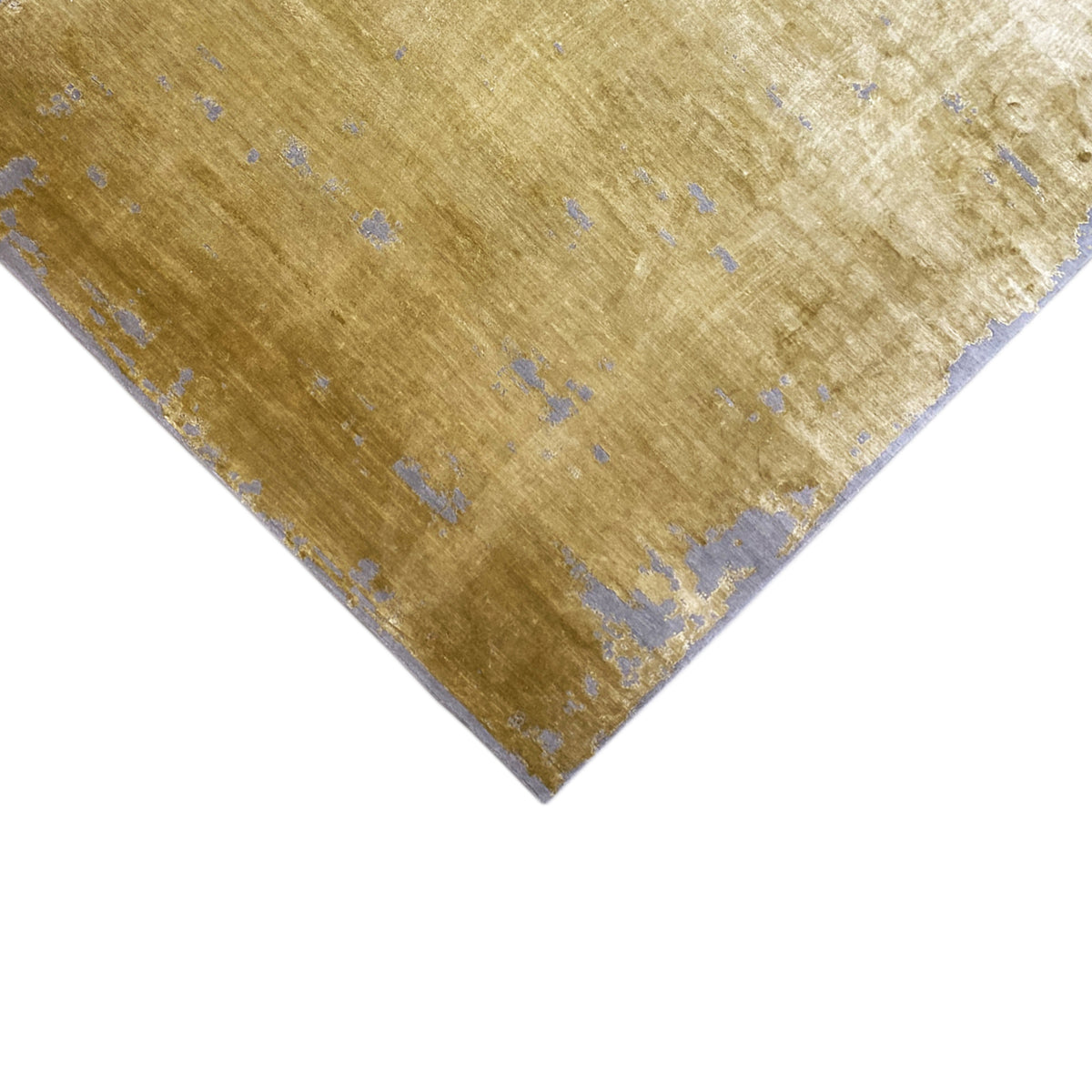 Modern yellow rug with blue-gray speckles, angled perspective