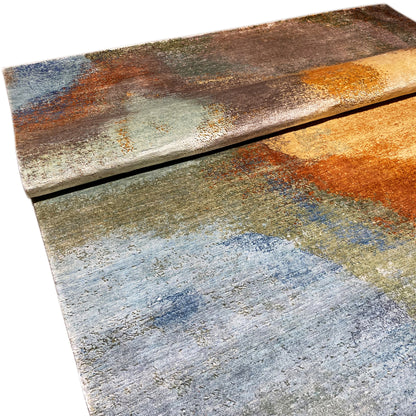 Modern rug 312x209 cm edge detail: layered look with blue, orange, and brown
