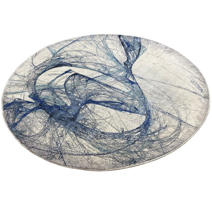 Round rug with abstract blue lines, a light gray base, and a striking patterned area