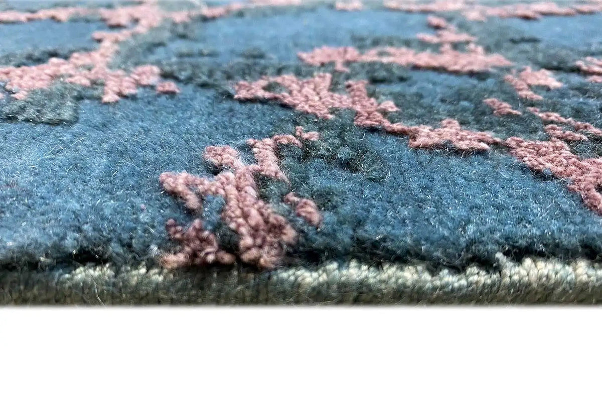 Carpet detail: blue fabric with pink pile, side edge