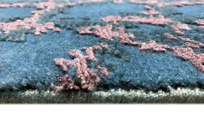 Carpet detail: blue fabric with pink pile, side edge