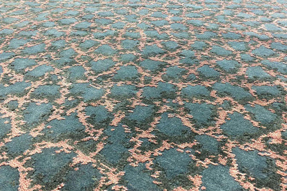 Carpet surface with a blue background and pink ornamental lines