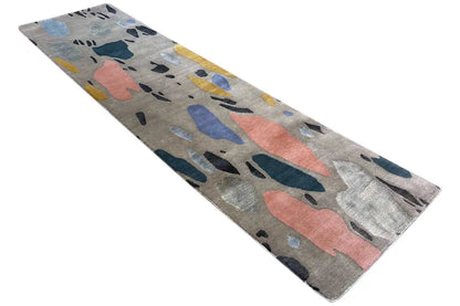 Terrazzo rug, long and narrow, abstract pattern in blue, coral, and yellow