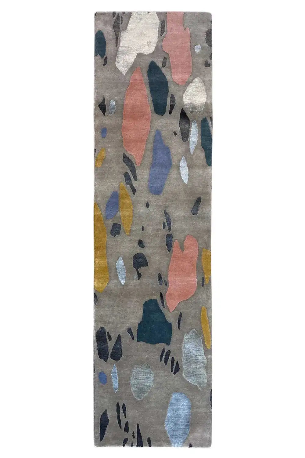 Rectangular terrazzo rug with an abstract pattern on a light gray background
