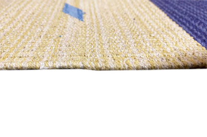 Close-up of the kilim runner rug: light woven surface with edge stripes