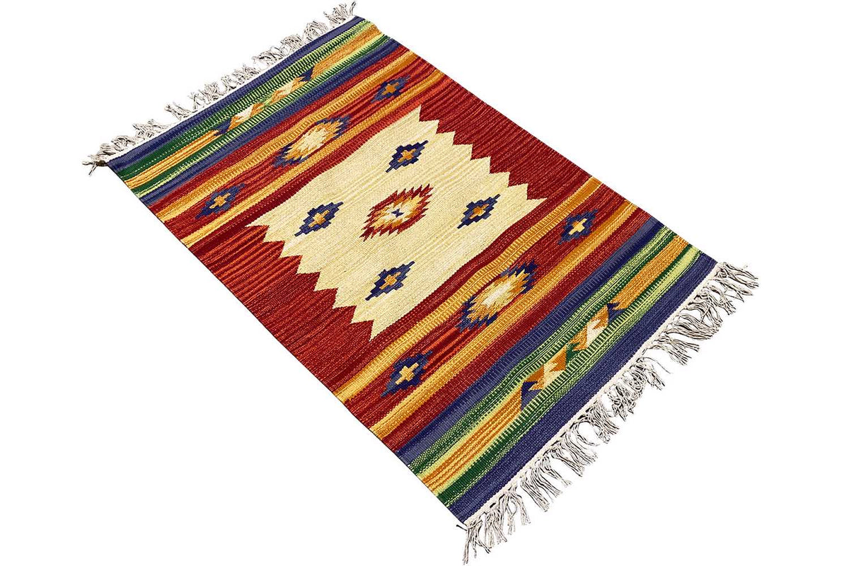 Kilim rug in angled view, red design with diamonds, multicolored stripes, and fringes