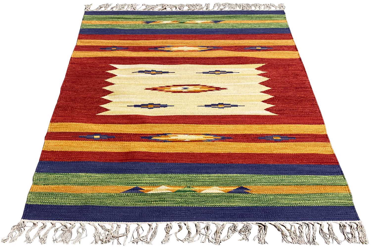 Kilim rug with a red-and-white zigzag pattern and colorful stripes, with fringes