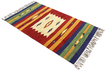 Diagonal kilim rug: reddish-brown geometric pattern with colorful stripes and fringes