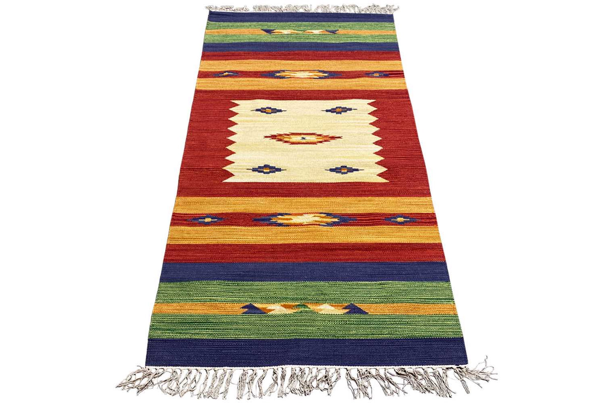 Woven rug with a zigzag pattern, reddish-brown stripes, blue and green accents, and fringe