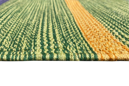 Woven kilim runner rug with green and yellow texture and relief pattern