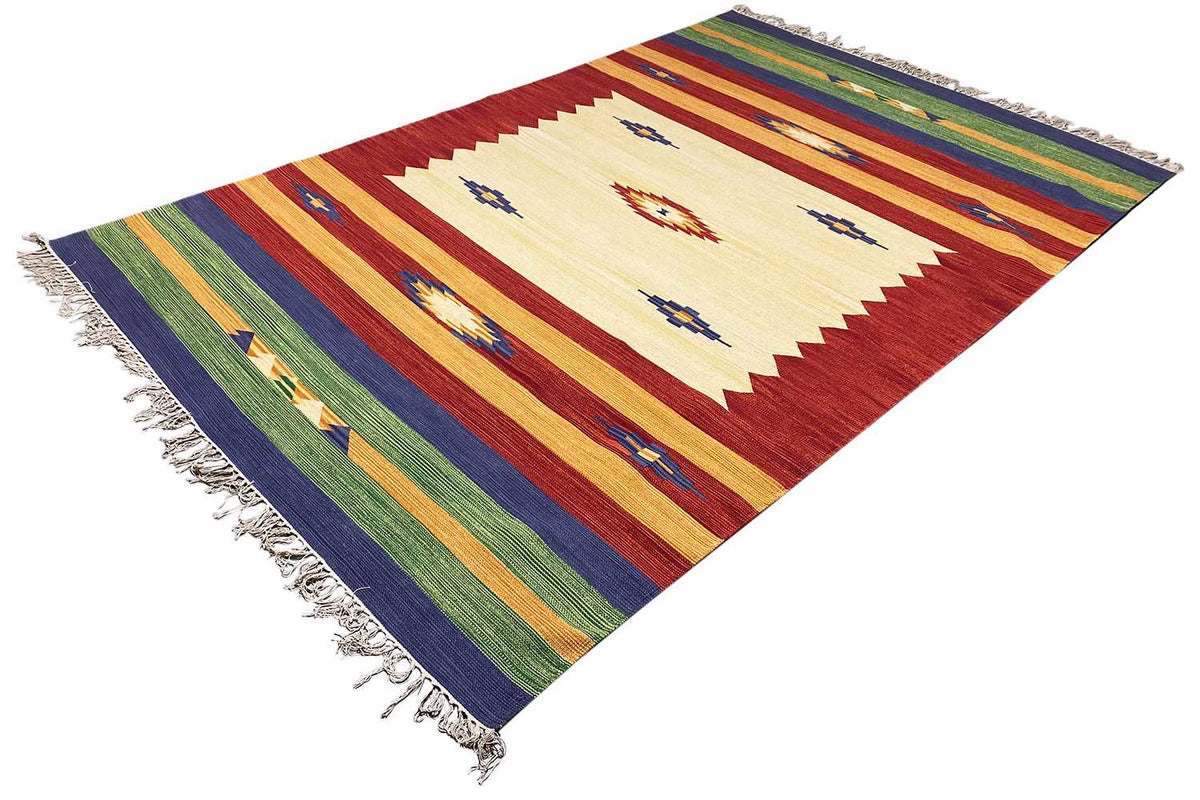 Diamond- and zigzag-patterned carpet in red, cream, blue, and with fringes