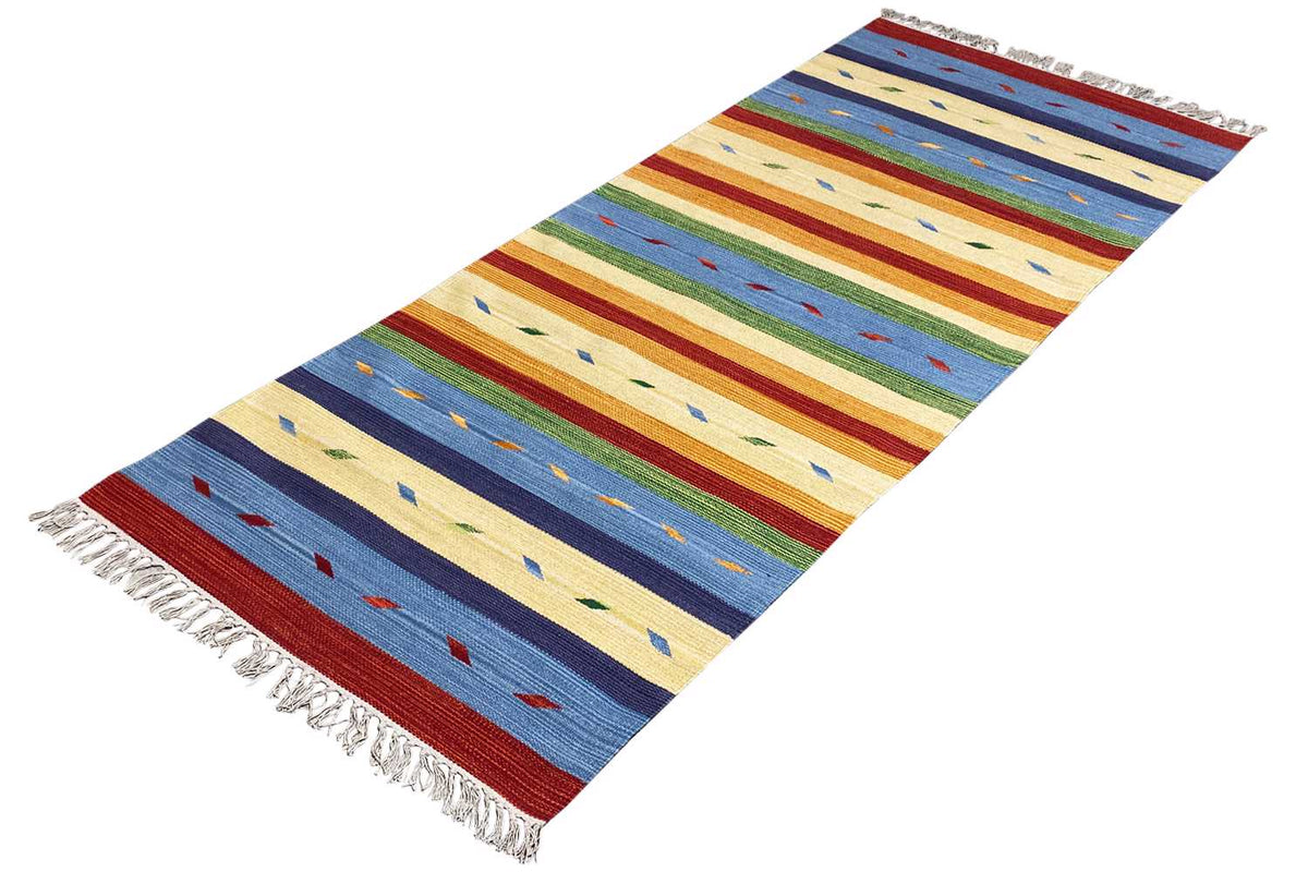 Modern kilim rug with horizontal stripes in yellow, blue, red, and green; fringes along the edges.
