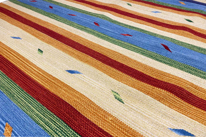 Kilim rug with a multicolored stripe and diamond pattern, fringes along the edge
