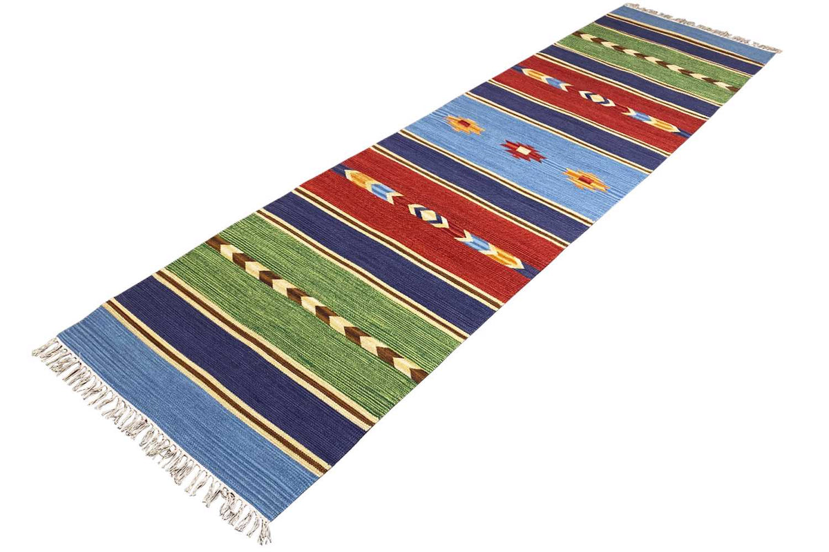 Kilim runner rug positioned at an angle, geometric stripe pattern, fringe
