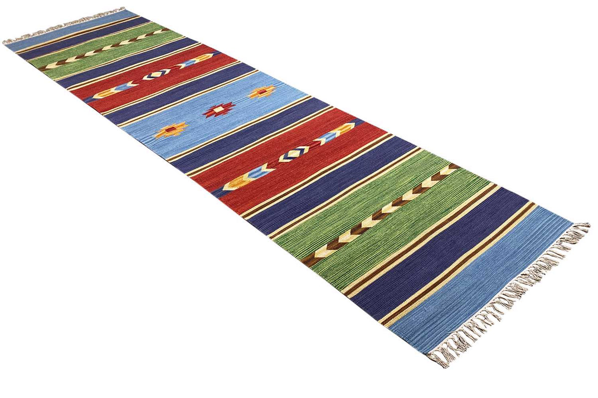 Kilim runner rug in angled view, multicolored stripes and fringes