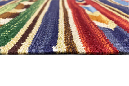Close-up: kilim rug with multicolored stripes and border, fringes