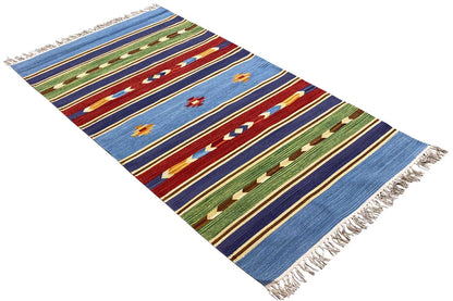 Kilim rug diagonal view: blue stripes with red and green patterns