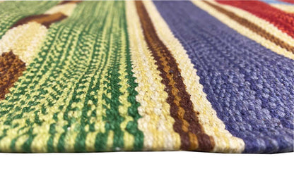 Kilim rug detail: woven stripes in green, yellow and blue