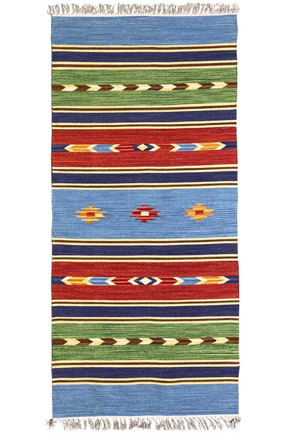 Blue kilim rug with stripes and colorful ornaments, fringes along the edges