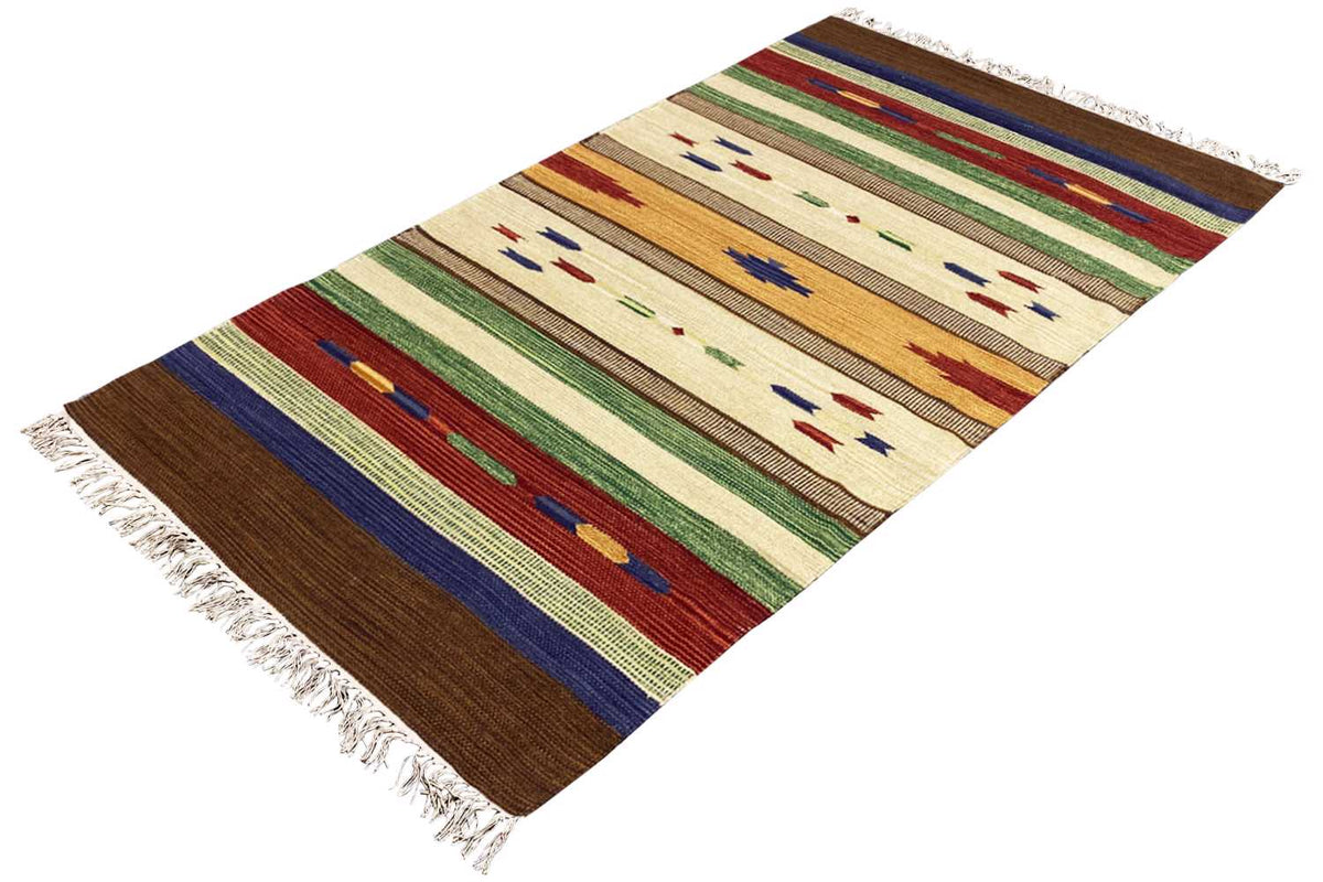 Kilim rug with a geometric pattern in cream, brown, green, and blue, diagonal view, fringes