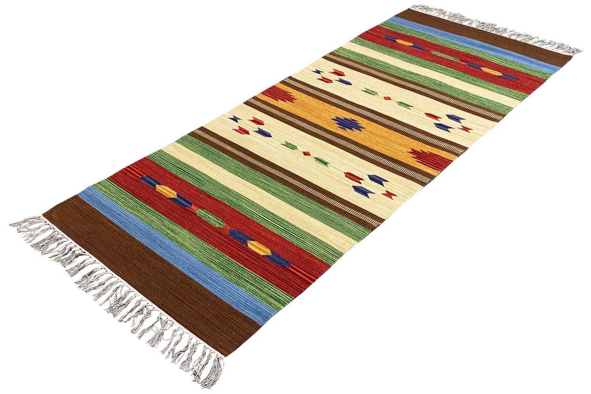 Carpet with fringes, elongated image with colorful stripes and diamonds on a light background