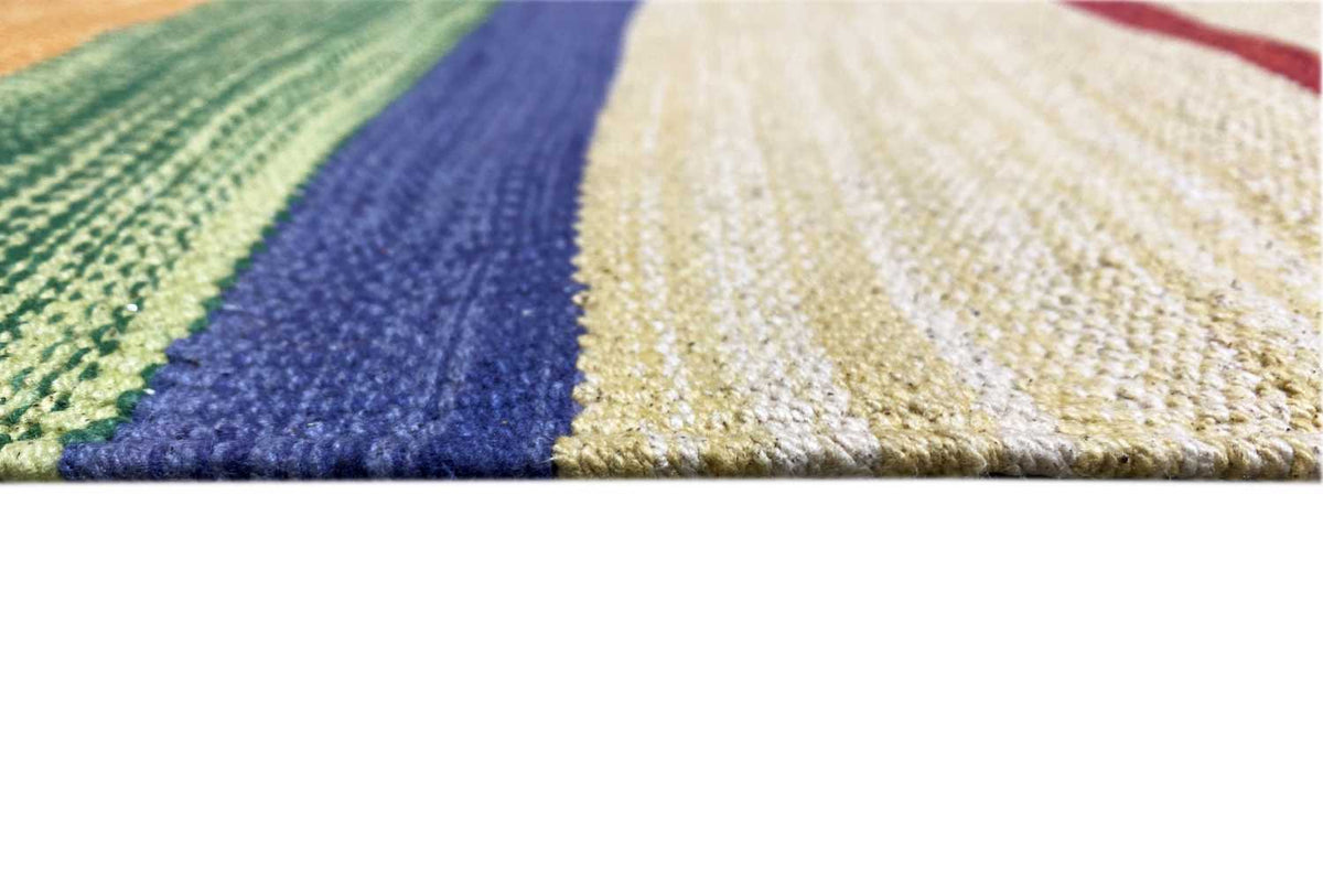 Kilim rug with diagonal stripes in green, blue and cream, side selvedge