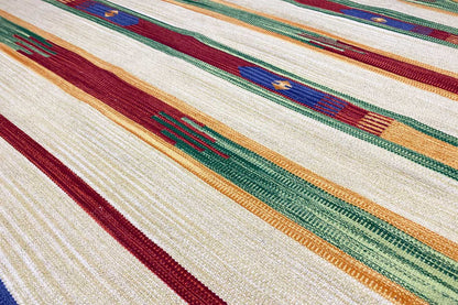 Kilim rug with wide border stripes in cream, dark red, green, and orange