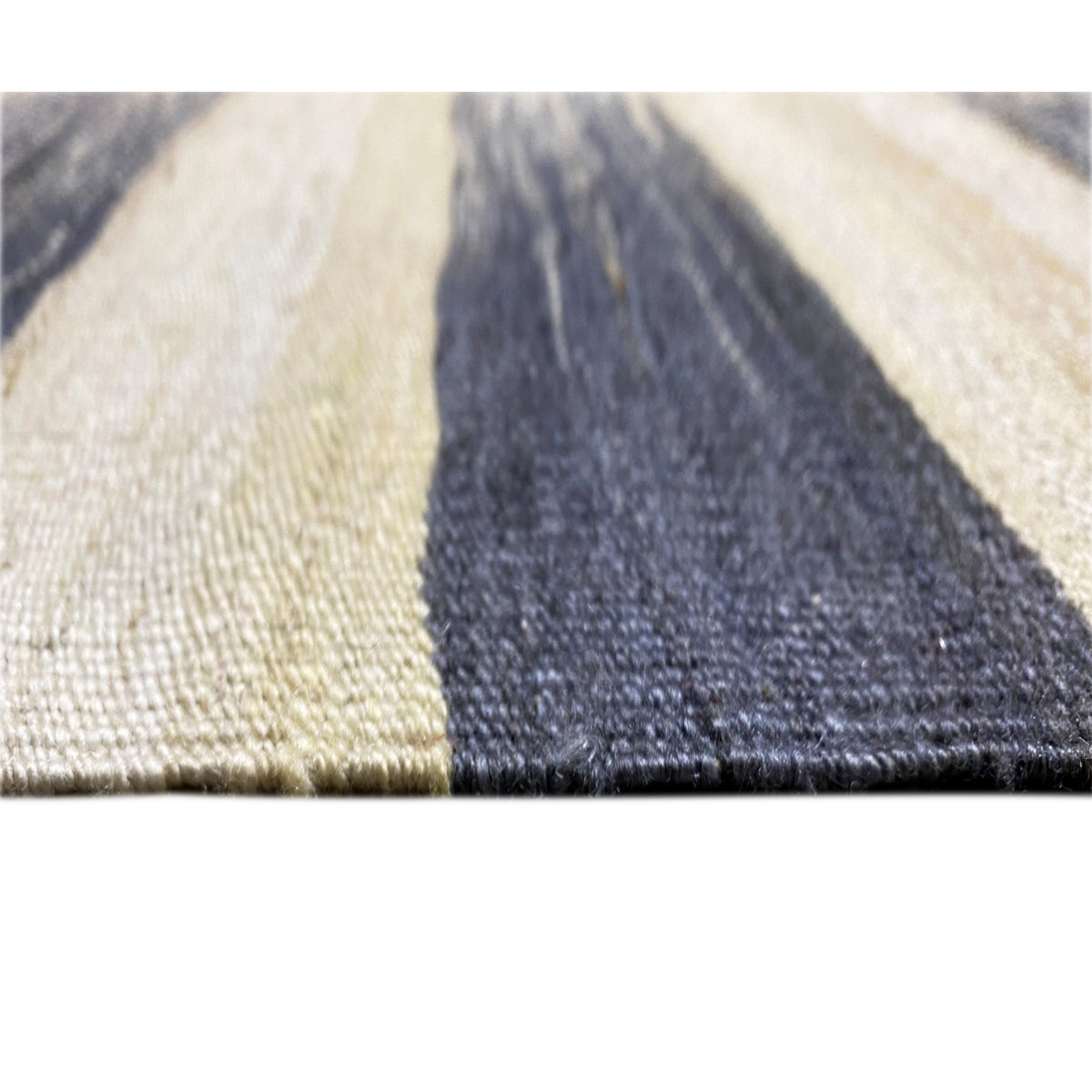 Close-up of Persian kilim 315x198 cm: cream-colored field with dark blue triangular area