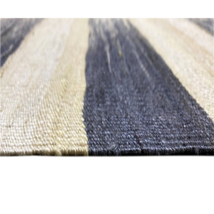 Close-up of Persian kilim 315x198 cm: cream-colored field with dark blue triangular area