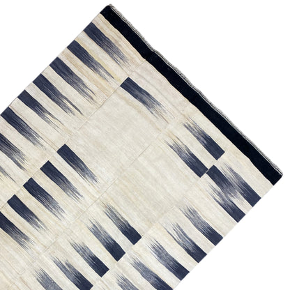 Persian kilim 315x198 cm, diagonal view: cream and dark blue rectangular stripes, border
