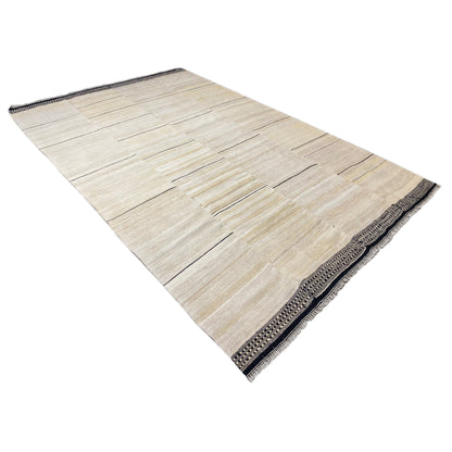 Persian kilim rug in the corner, cream-colored surface with a narrow dark border