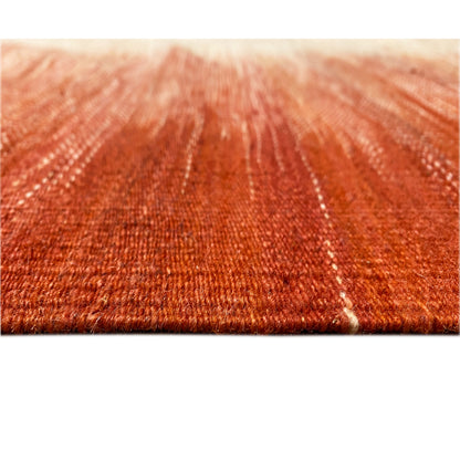 Textile detail of the kilim: dense reddish-brown pile with fine lines and subtle patina