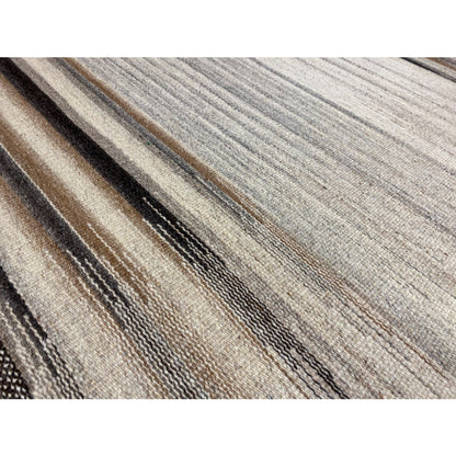 Close-up: kilim fabric with fine linear stripes and a marled weave texture