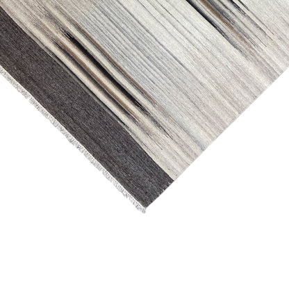 Kilim rug with a dark horizontal line, light stripes, and visible fringes