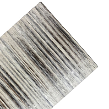 Close-up of the kilim dhurrie with multicolored horizontal stripes in gray and beige