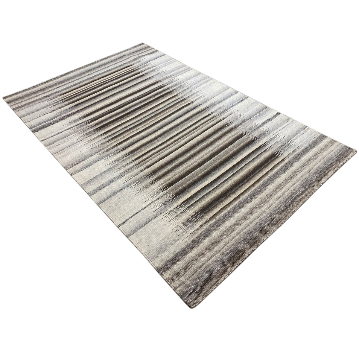 Gray dhurrie with a diagonal stripe pattern of light and dark lines