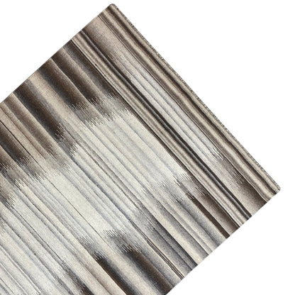 Close-up of a Kilim-Dhurrie rug: even stripes in beige, gray, and brown