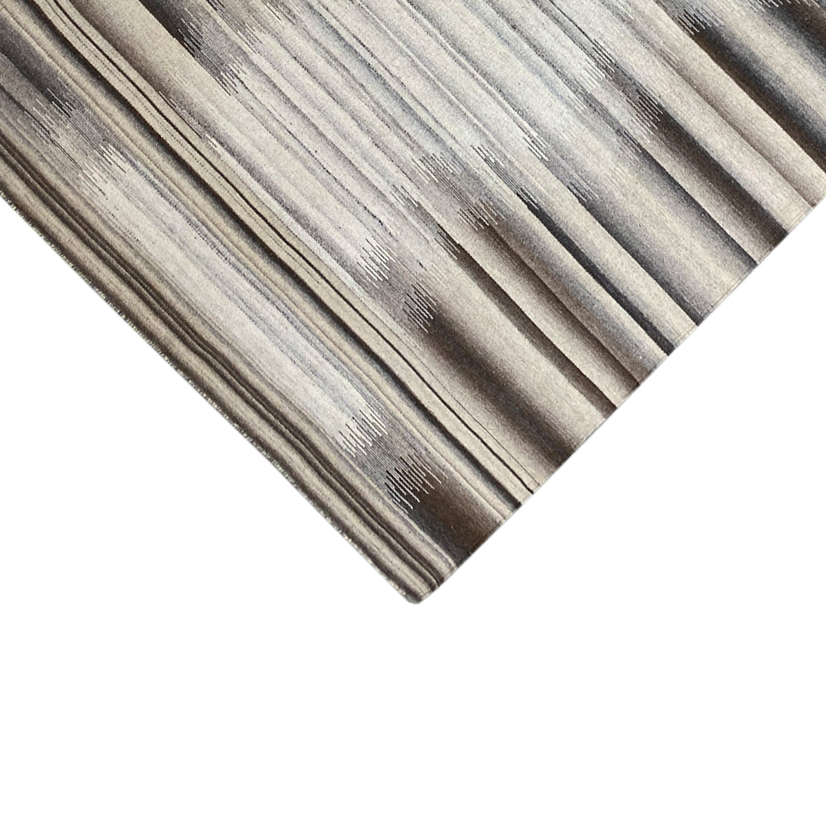 Close-up of a kelim dhurrie rug: abstract stripes with a subtle textured effect