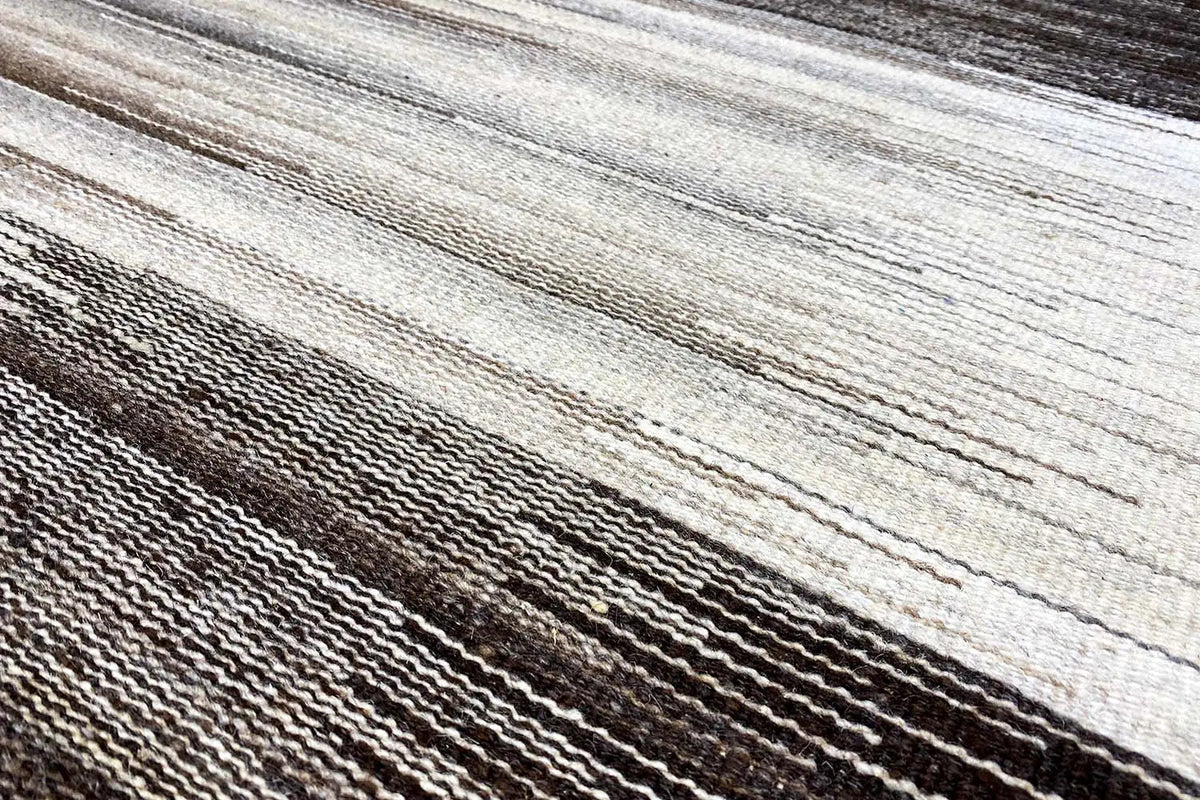 Detail of the kilim rug weave: horizontal stripes and fine fiber texture
